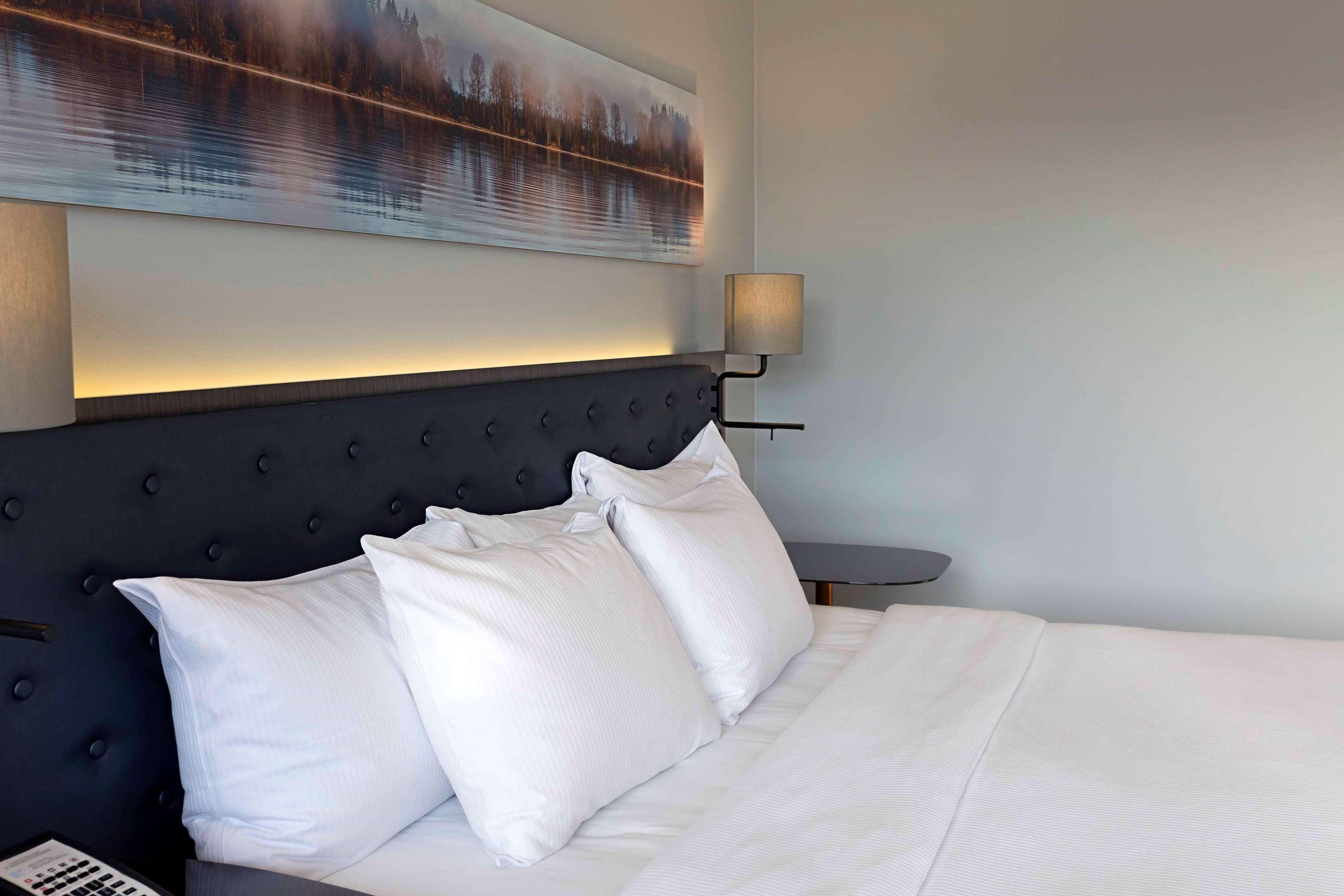 Hilton Helsinki Strand Exterior photo A bed with three pillows