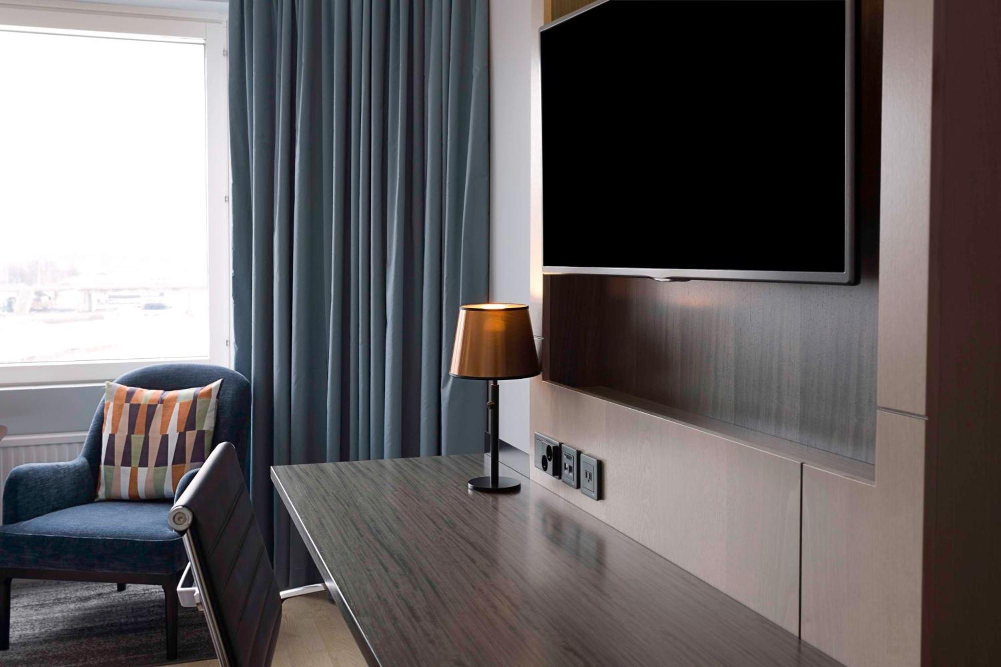 Hilton Helsinki Strand Exterior photo A television in a hotel room